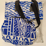 Blue and white patterned tote bag with black straps