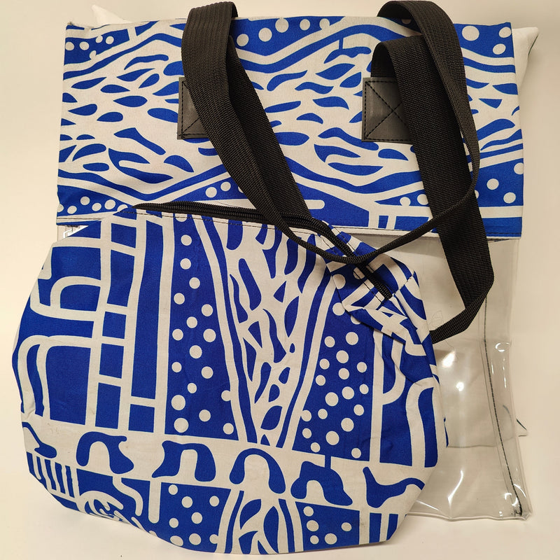 Blue and white patterned tote bag with black straps